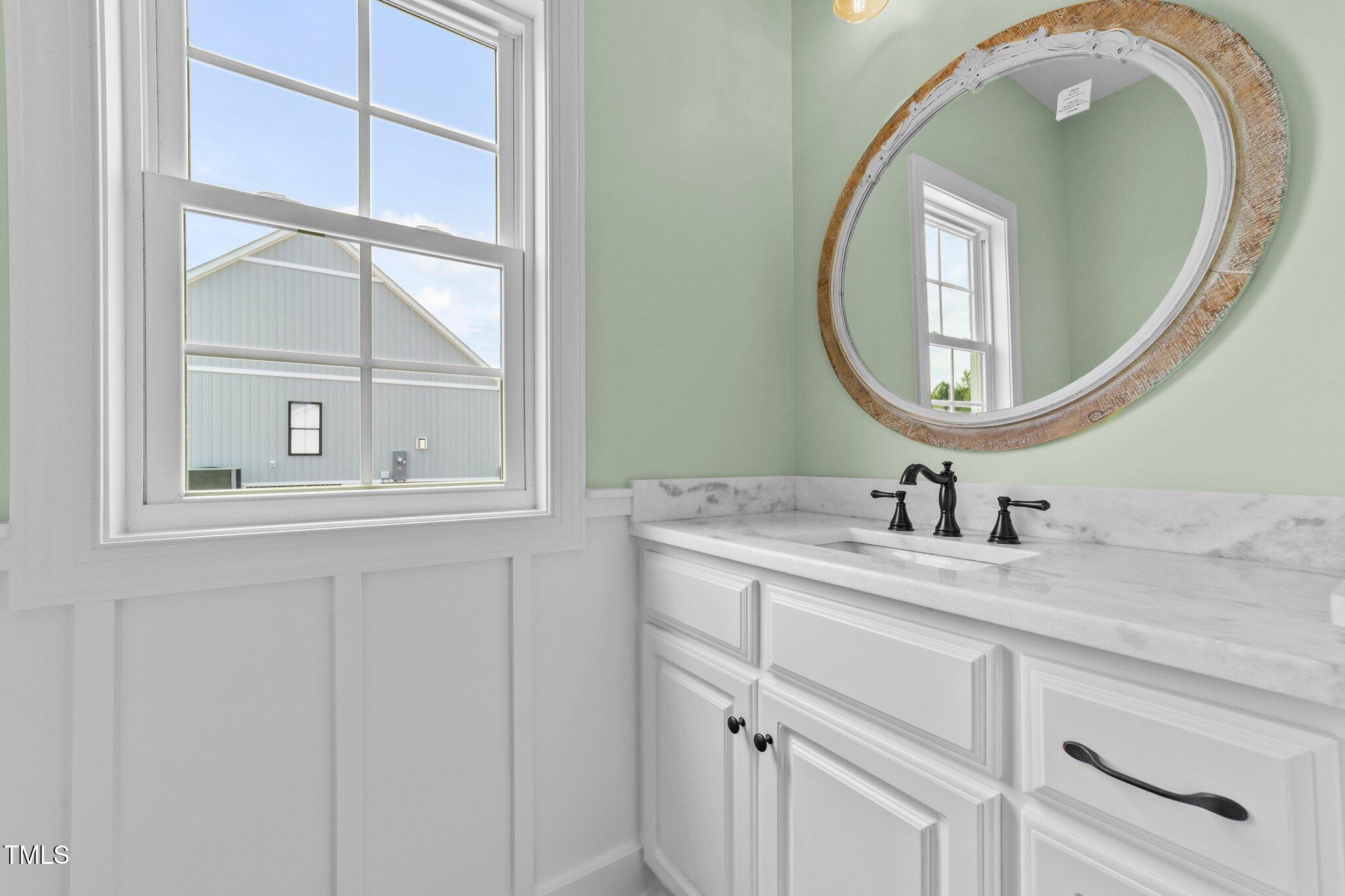 2379 Heartland Road Battleboro, NC 27809 - Photo 21 of 44 a bathroom with a granite countertop sink and a mirror