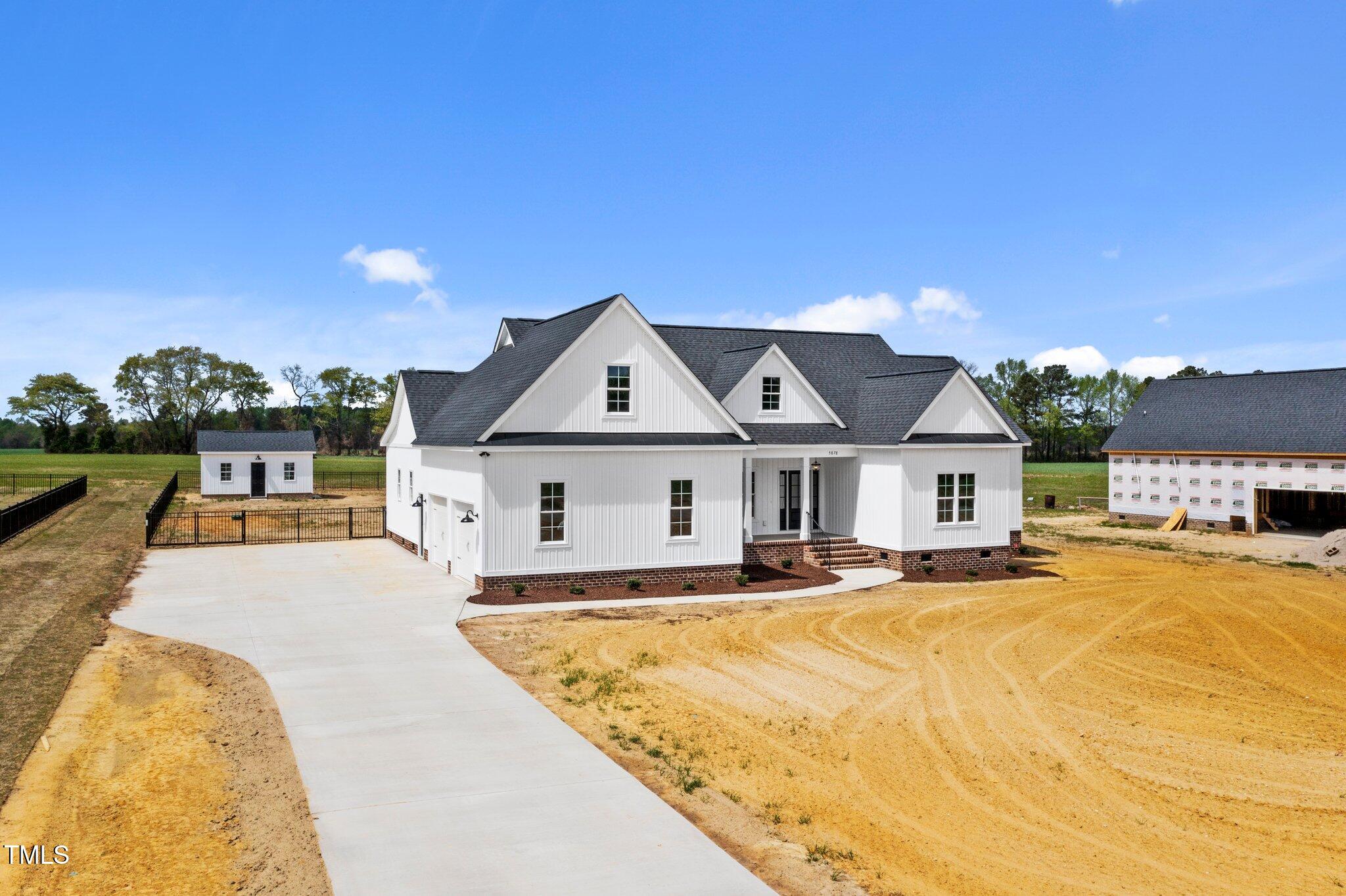 2379 Heartland Road Battleboro, NC 27809 - Photo 28 of 44 a view of a white house with a yard
