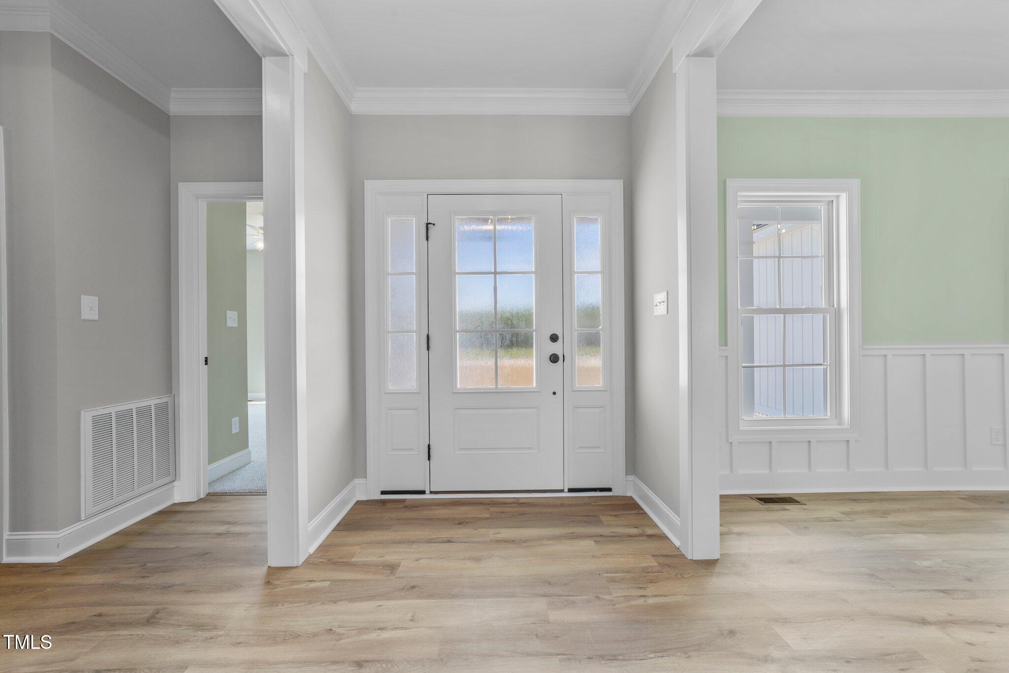 2379 Heartland Road Battleboro, NC 27809 - Photo 4 of 44 an empty room with wooden floor and windows