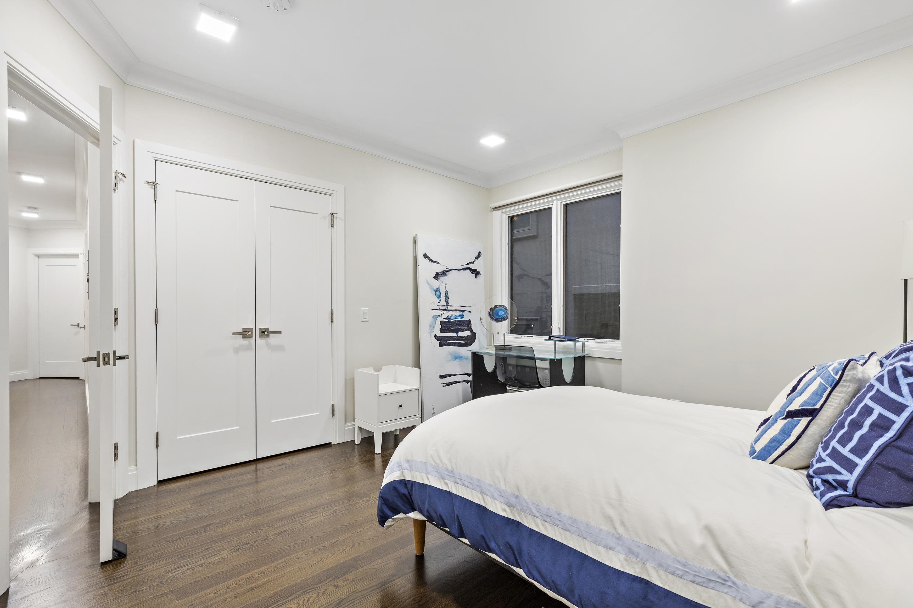 640 Undercliff Avenue Edgewater, NJ 07020 - Photo 14 of 26 a bed room with a bed and a window