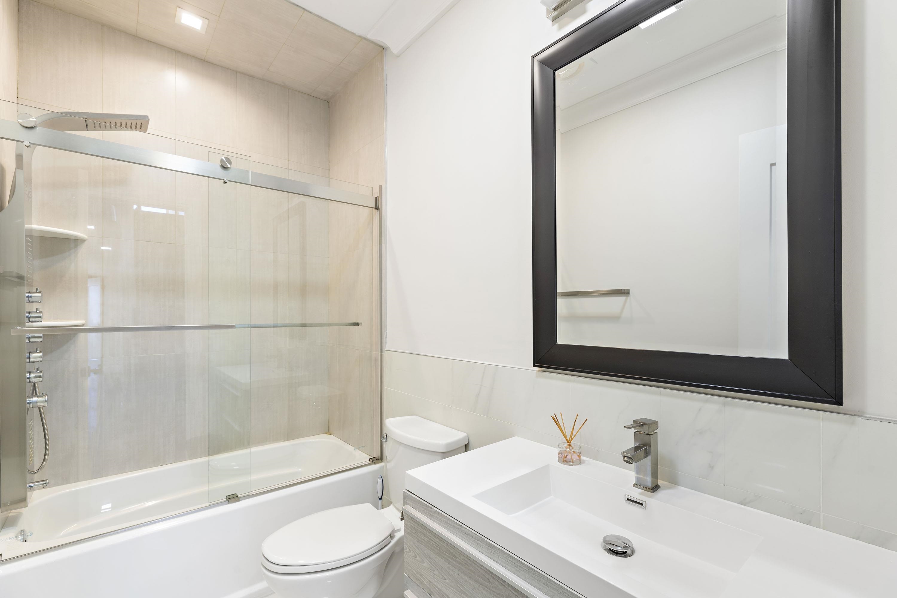 640 Undercliff Avenue Edgewater, NJ 07020 - Photo 15 of 26 a bathroom with a sink toilet and shower