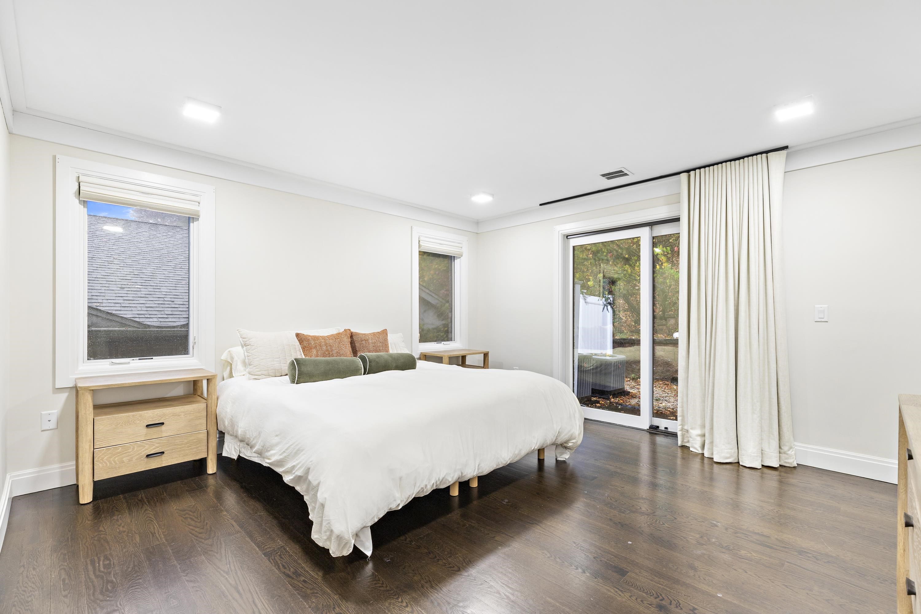 640 Undercliff Avenue Edgewater, NJ 07020 - Photo 18 of 26 a bedroom with a bed and large window