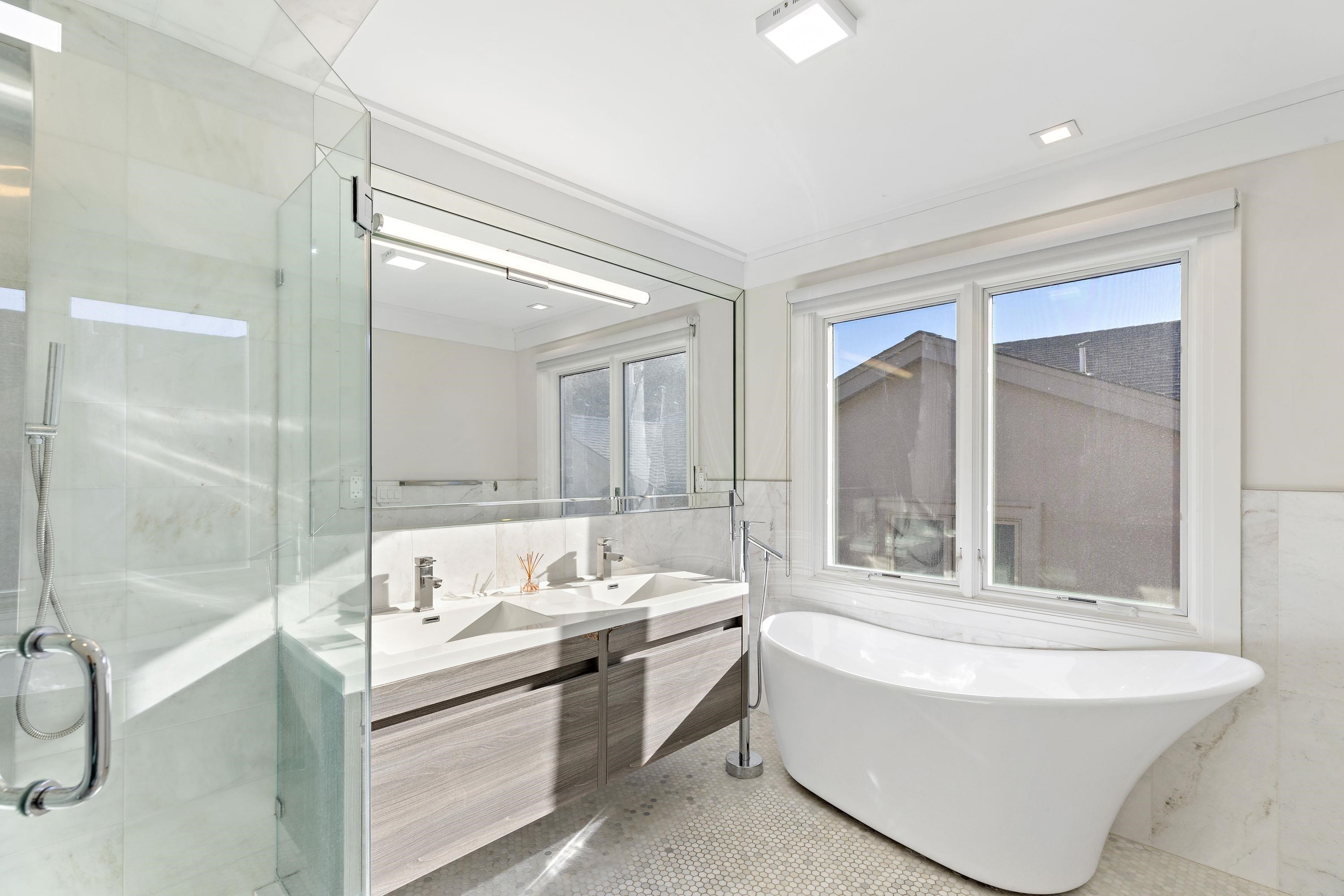 640 Undercliff Avenue Edgewater, NJ 07020 - Photo 20 of 26 a bathroom with a tub sink shower and mirror