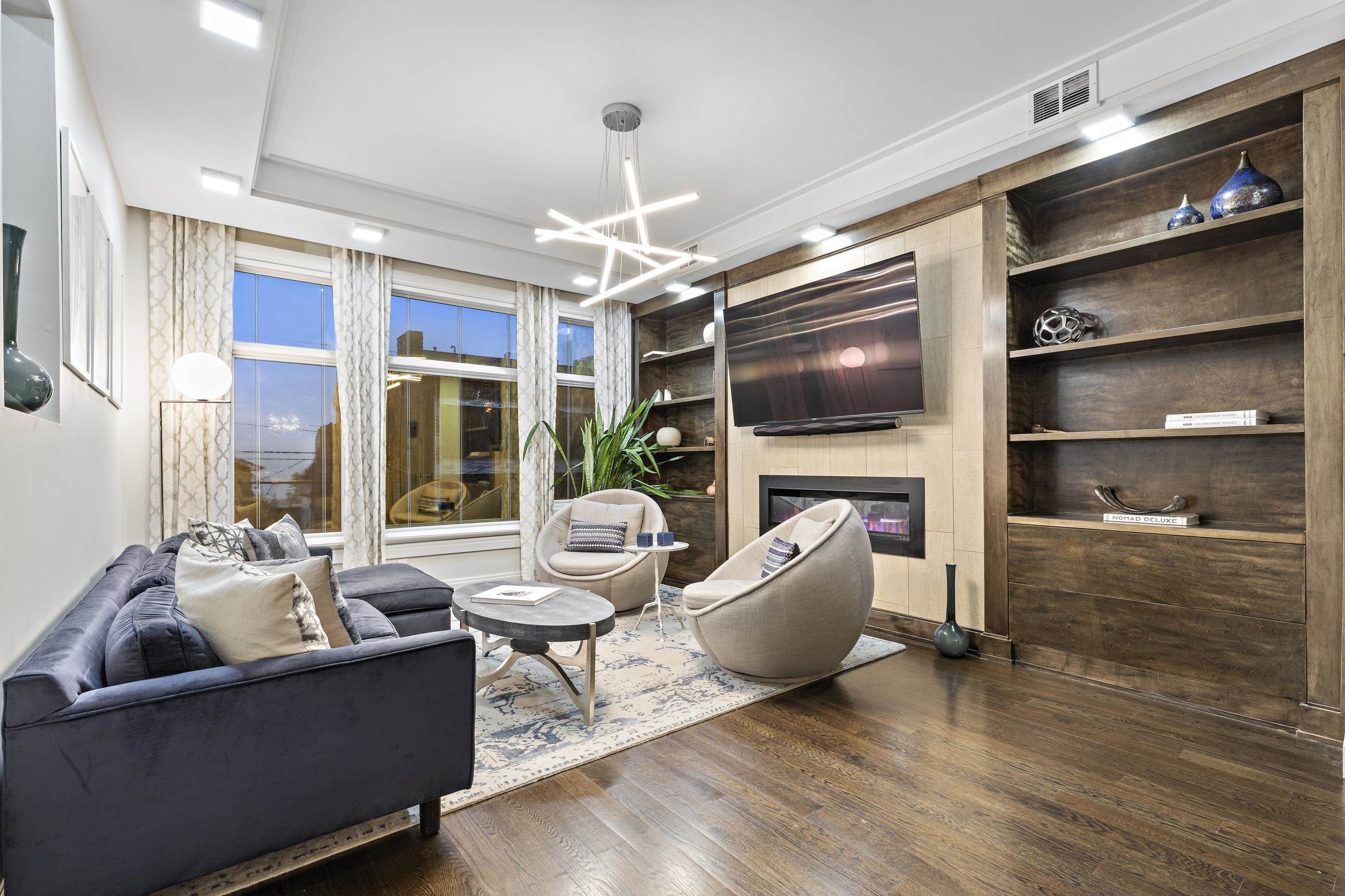 640 Undercliff Avenue Edgewater, NJ 07020 - Photo 2 of 26 a living room with furniture and a flat screen tv