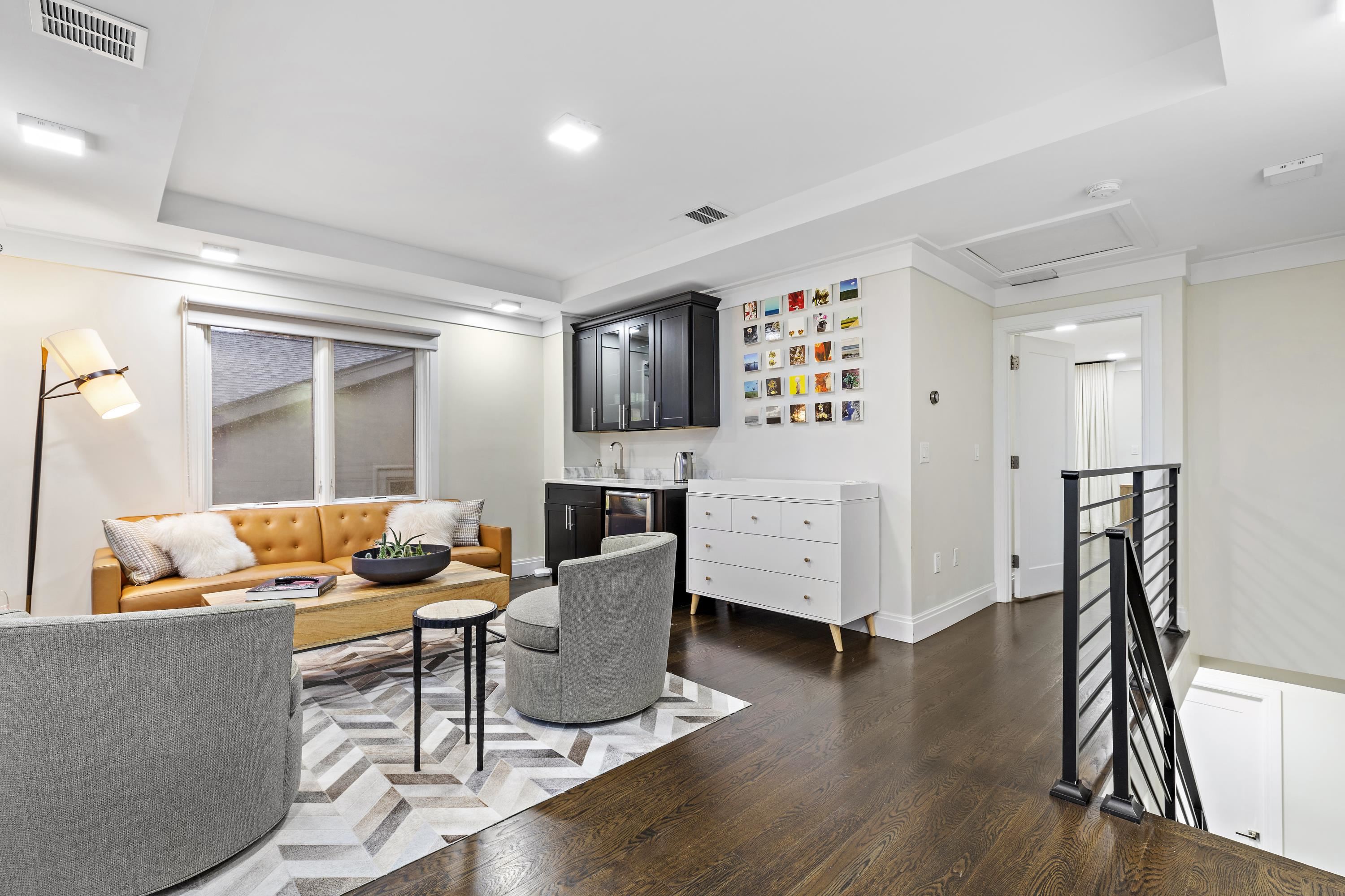 640 Undercliff Avenue Edgewater, NJ 07020 - Photo 21 of 26 a living room with furniture and a wooden floor