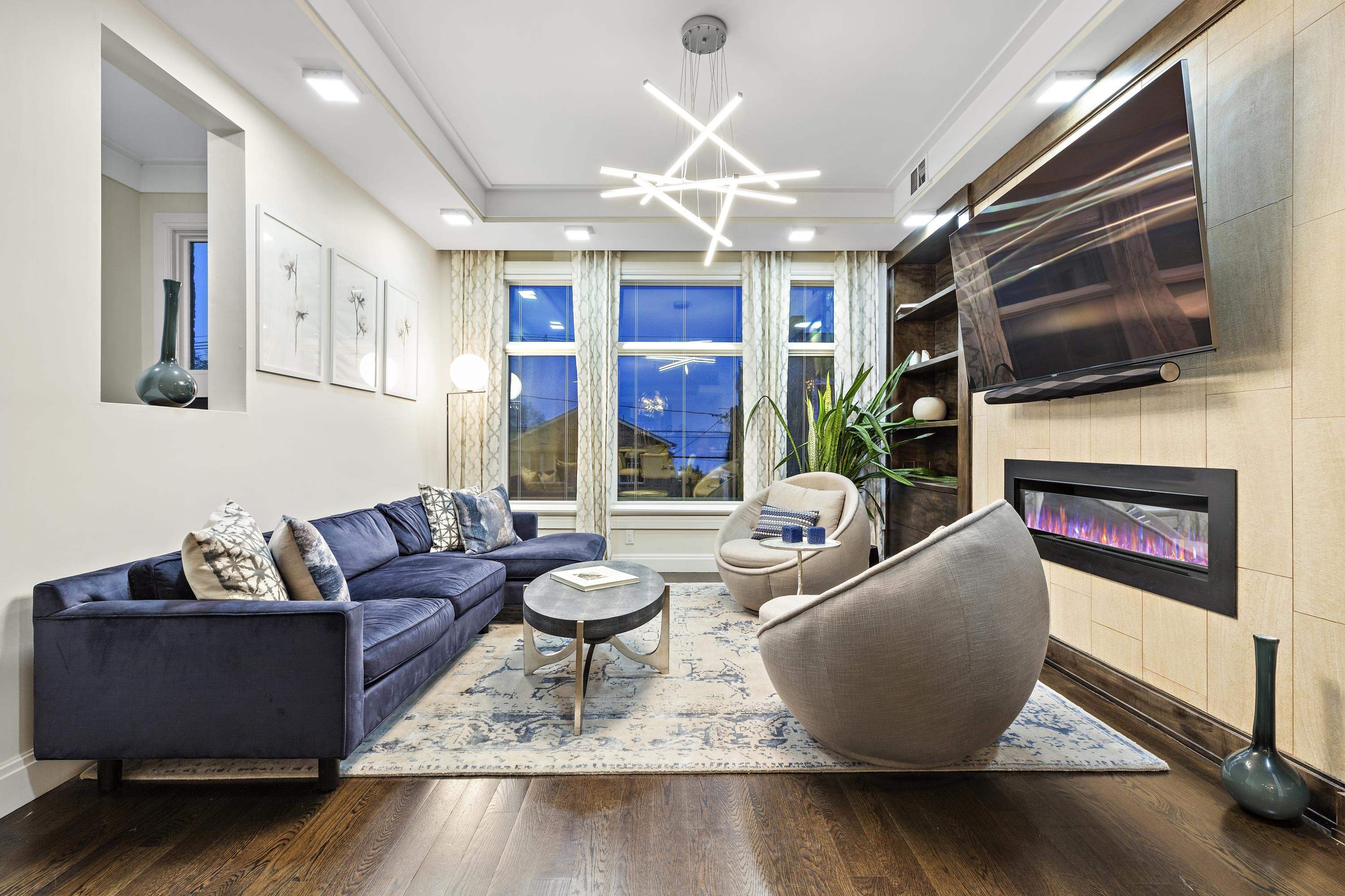 640 Undercliff Avenue Edgewater, NJ 07020 - Photo 3 of 26 a living room with fireplace furniture and a flat screen tv