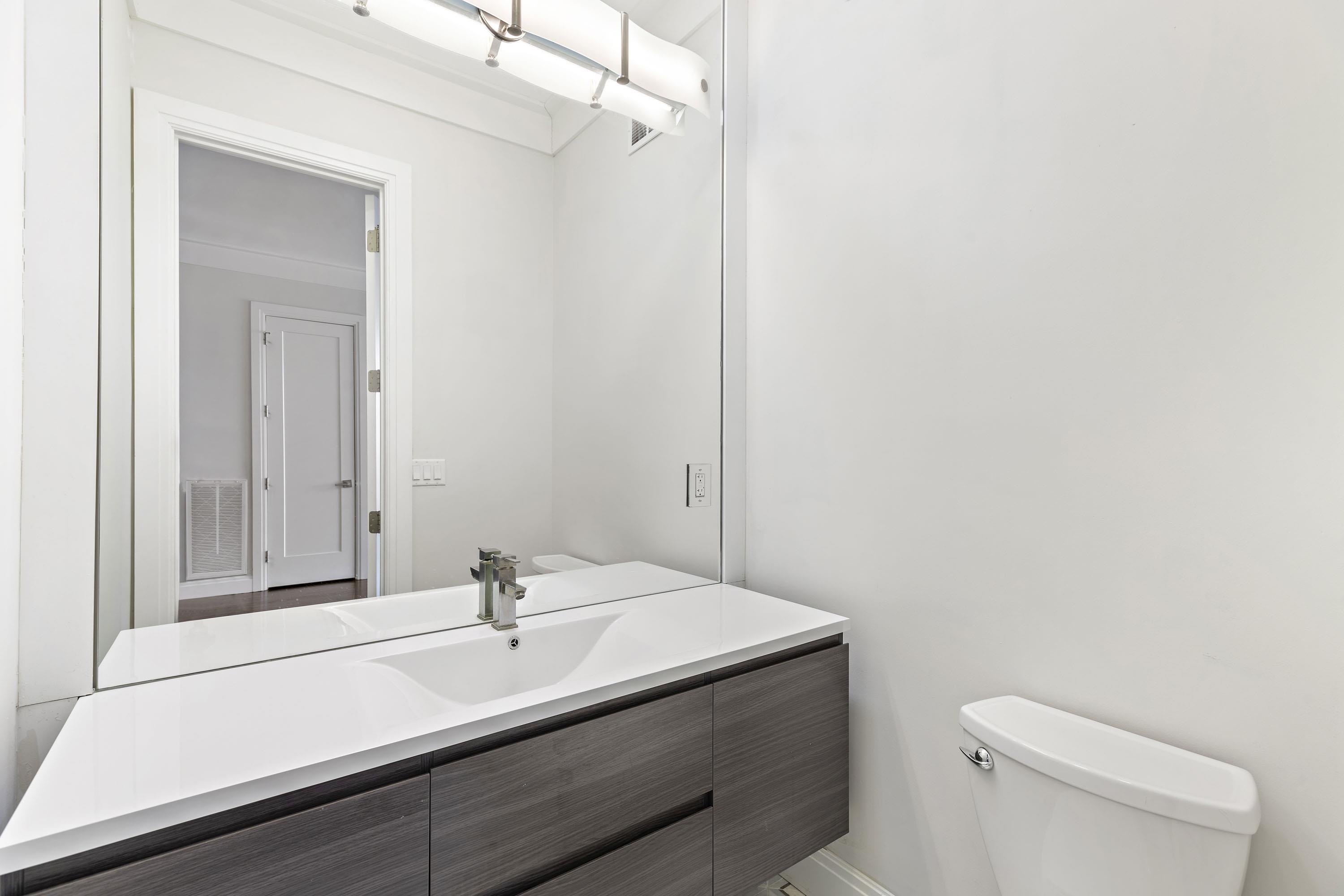 640 Undercliff Avenue Edgewater, NJ 07020 - Photo 9 of 26 a bathroom with a sink a toilet and shower