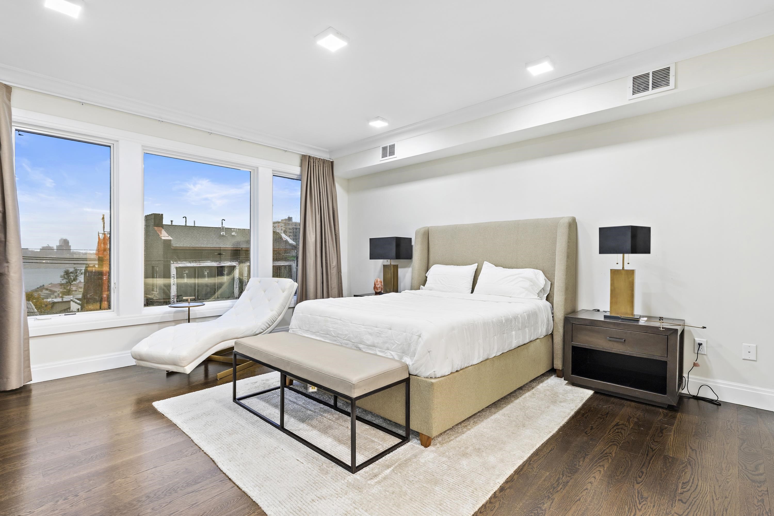 640 Undercliff Avenue Edgewater, NJ 07020 - Photo 10 of 26 a spacious bedroom with a bed and large window