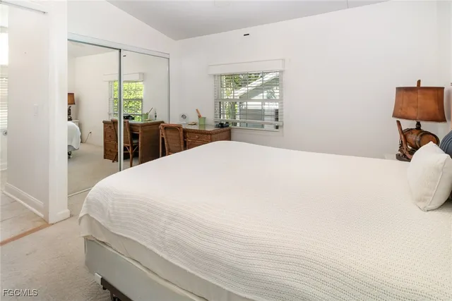 a large white bed in a white room