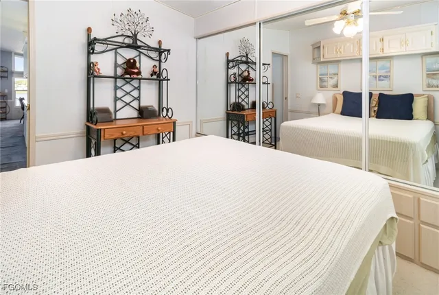 a bedroom with a bed and dresser