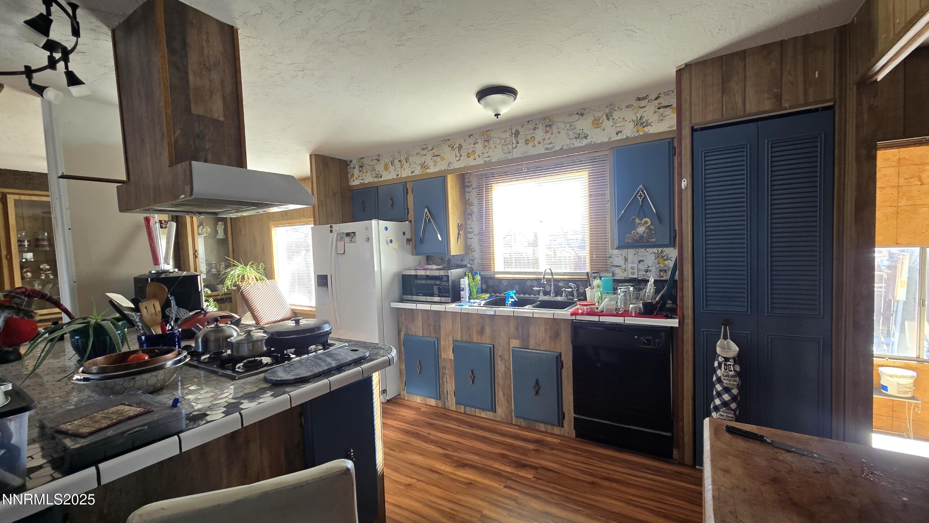 3801 Citrus Street Silver Springs, NV 89429 - Photo 7 of 27 a kitchen with stainless steel appliances a stove and a refrigerator