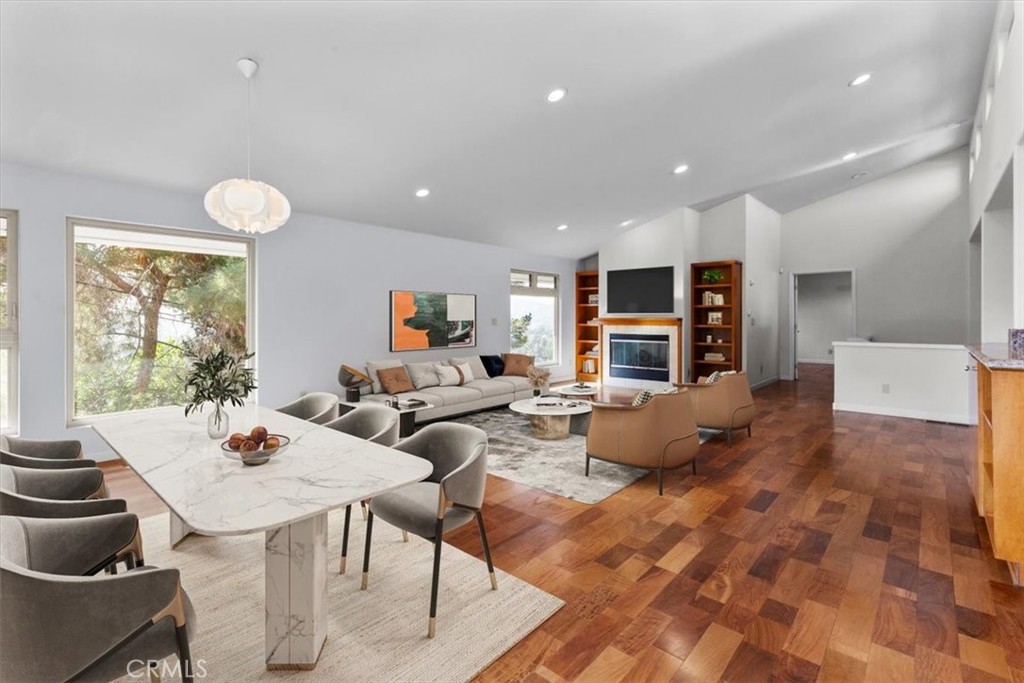 2377 Silver Ridge Avenue Los Angeles, CA 90039 - Photo 14 of 46 a living room with furniture a fireplace and a open kitchen view