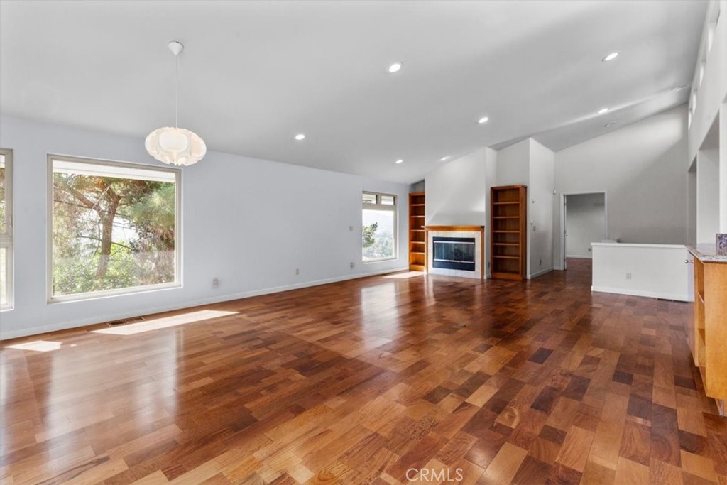 2377 Silver Ridge Avenue Los Angeles, CA 90039 - Photo 15 of 46 an empty room with wooden floor and windows