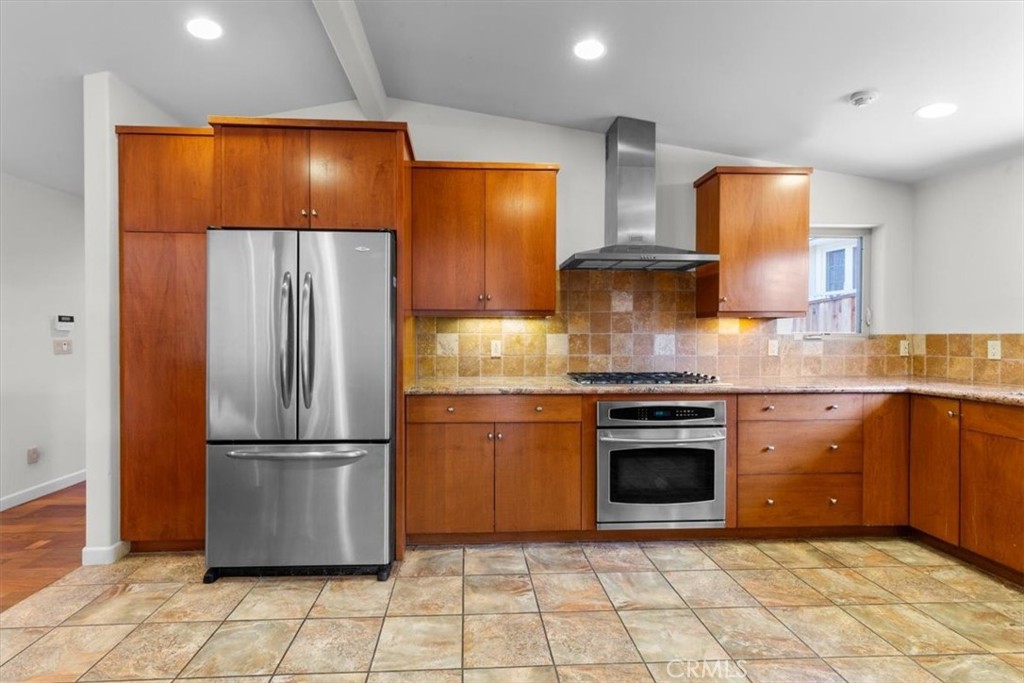 2377 Silver Ridge Avenue Los Angeles, CA 90039 - Photo 19 of 46 a kitchen with stainless steel appliances granite countertop a refrigerator and a stove top oven