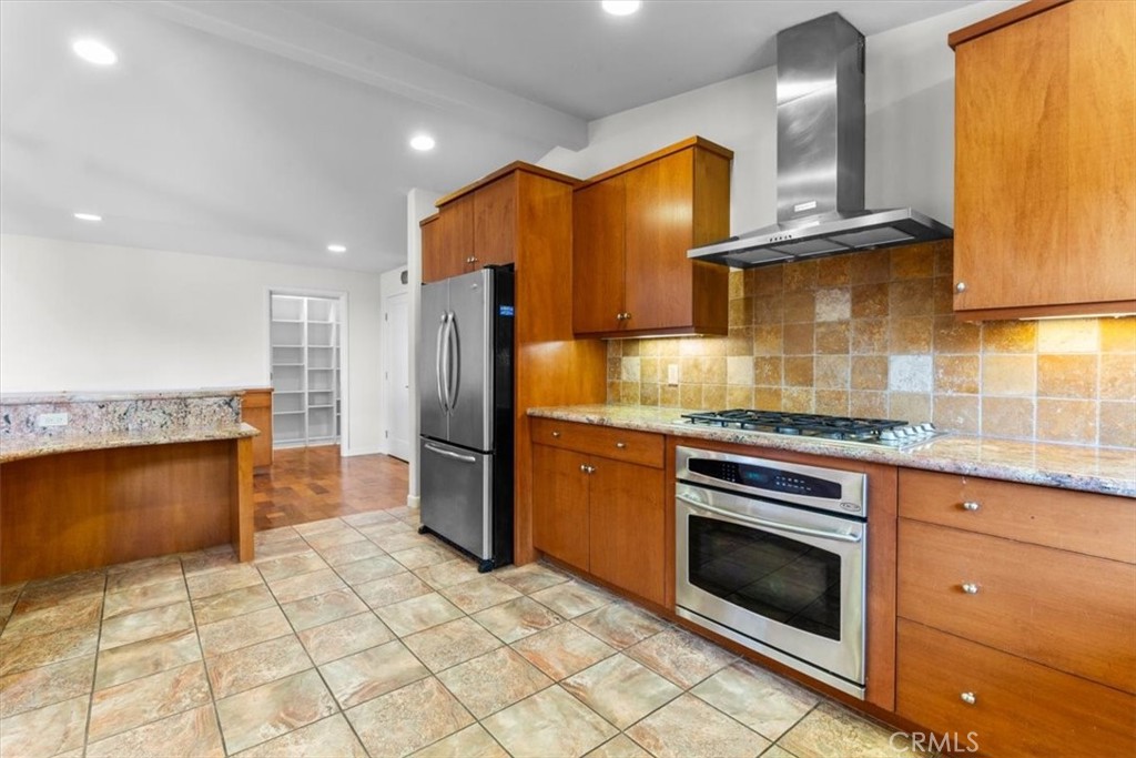 2377 Silver Ridge Avenue Los Angeles, CA 90039 - Photo 21 of 46 a kitchen with stainless steel appliances granite countertop a stove a sink and a refrigerator