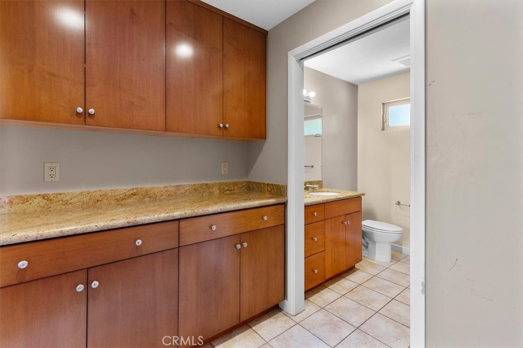 2377 Silver Ridge Avenue Los Angeles, CA 90039 - Photo 25 of 46 a spacious bathroom with a granite countertop sink and a mirror