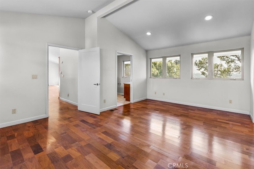 2377 Silver Ridge Avenue Los Angeles, CA 90039 - Photo 32 of 46 an empty room with wooden floor and windows