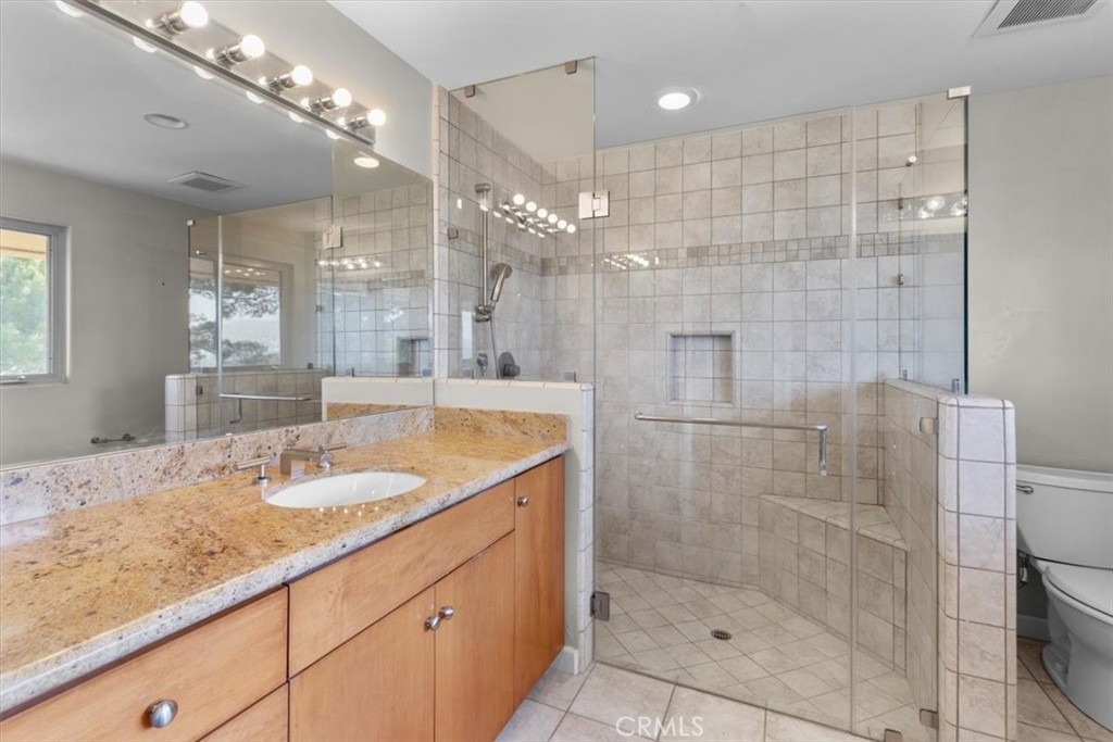 2377 Silver Ridge Avenue Los Angeles, CA 90039 - Photo 40 of 46 a bathroom with a granite countertop shower sink and mirror