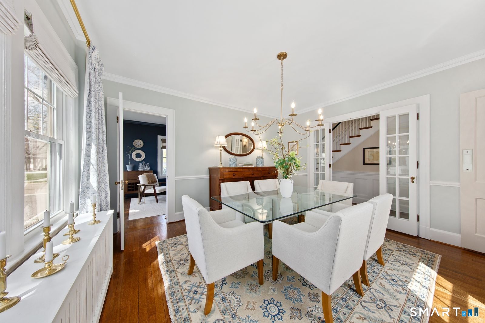 41 Chester Street Stamford, CT 06905 - Photo 12 of 40 a living room with furniture a chandelier and a table
