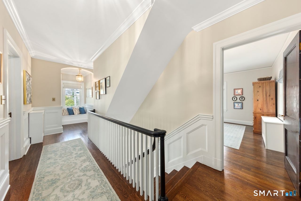 41 Chester Street Stamford, CT 06905 - Photo 20 of 40 a view of a hallway view with wooden floor and staircase