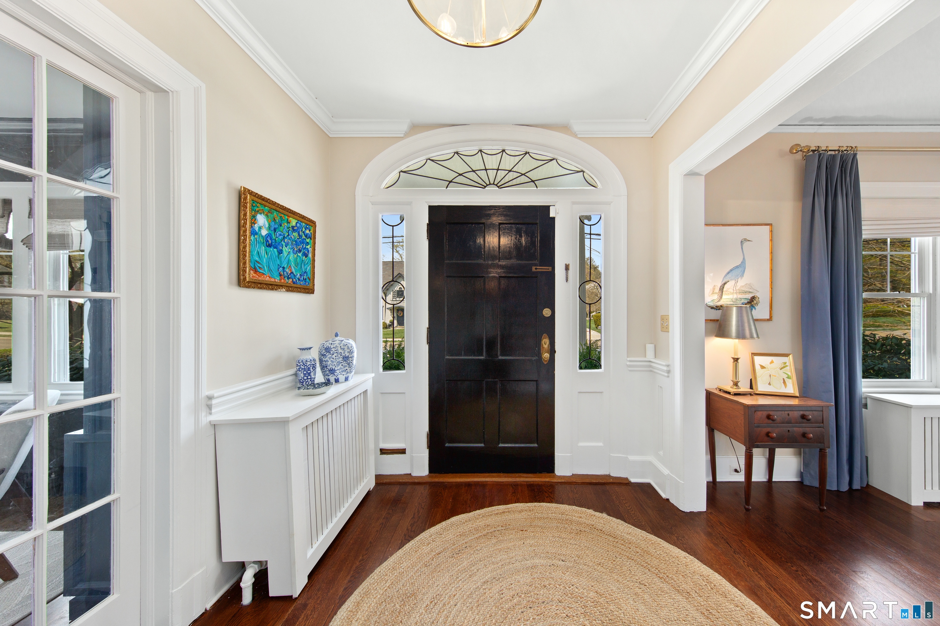 41 Chester Street Stamford, CT 06905 - Photo 4 of 40 a spacious bedroom with a bed and a table in it