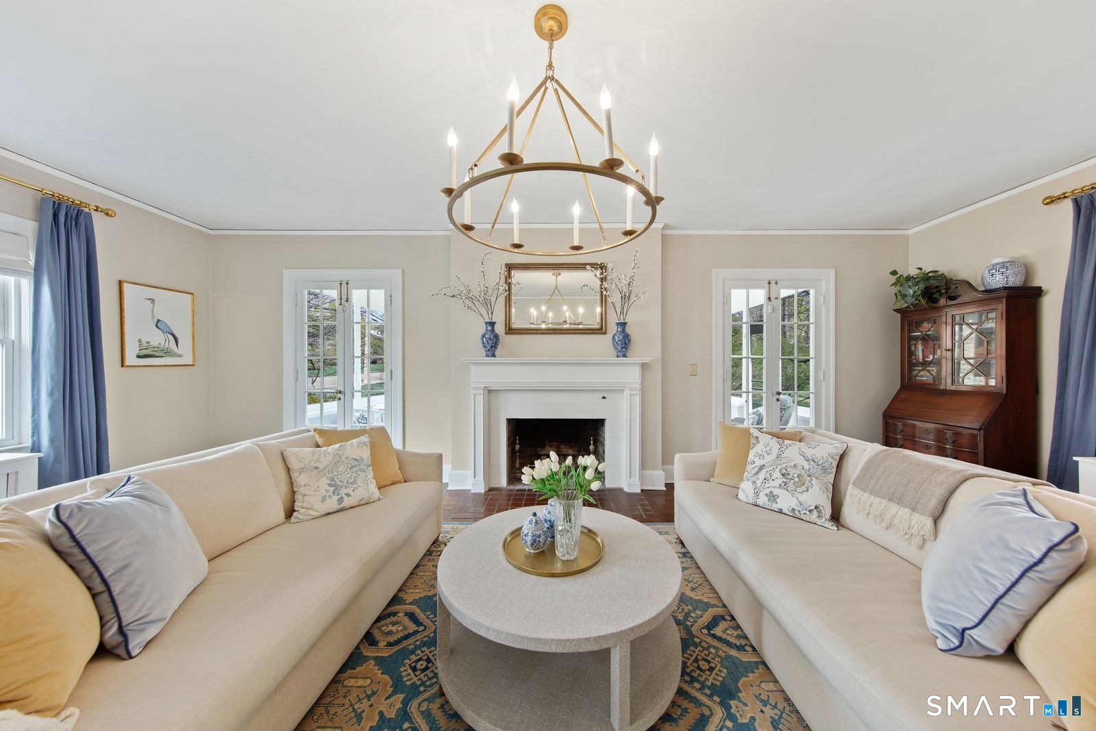 41 Chester Street Stamford, CT 06905 - Photo 6 of 40 a living room with furniture a fireplace and a chandelier