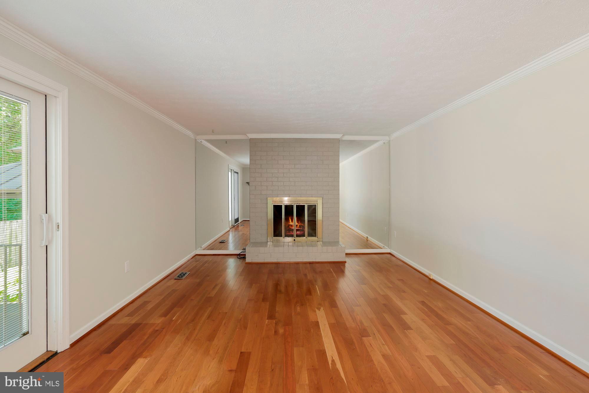 385 Yorkshire Lane Riva, MD 21140 - Photo 10 of 36 Family Room w/fireplace and gorgeous floors.