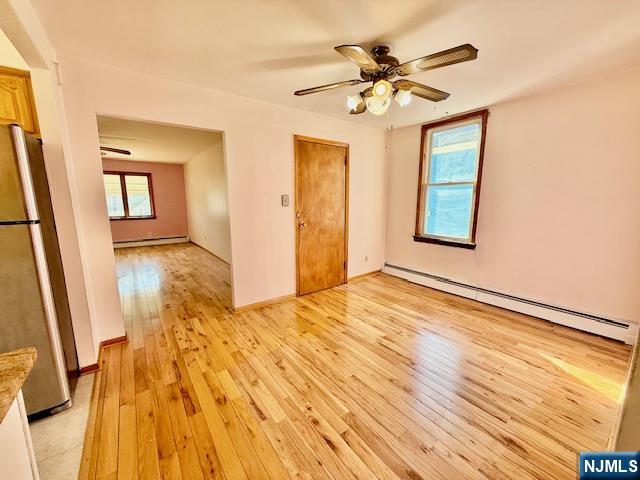 46 Frances Street, Unit 2 Clifton, NJ 07014 - Photo 3 of 8 a view of empty room with wooden floor and fan