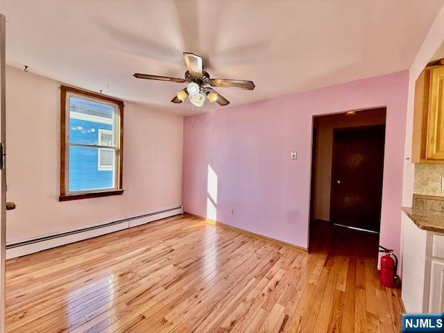 46 Frances Street, Unit 2 Clifton, NJ 07014 - Photo 4 of 8 a view of an empty room with wooden floor