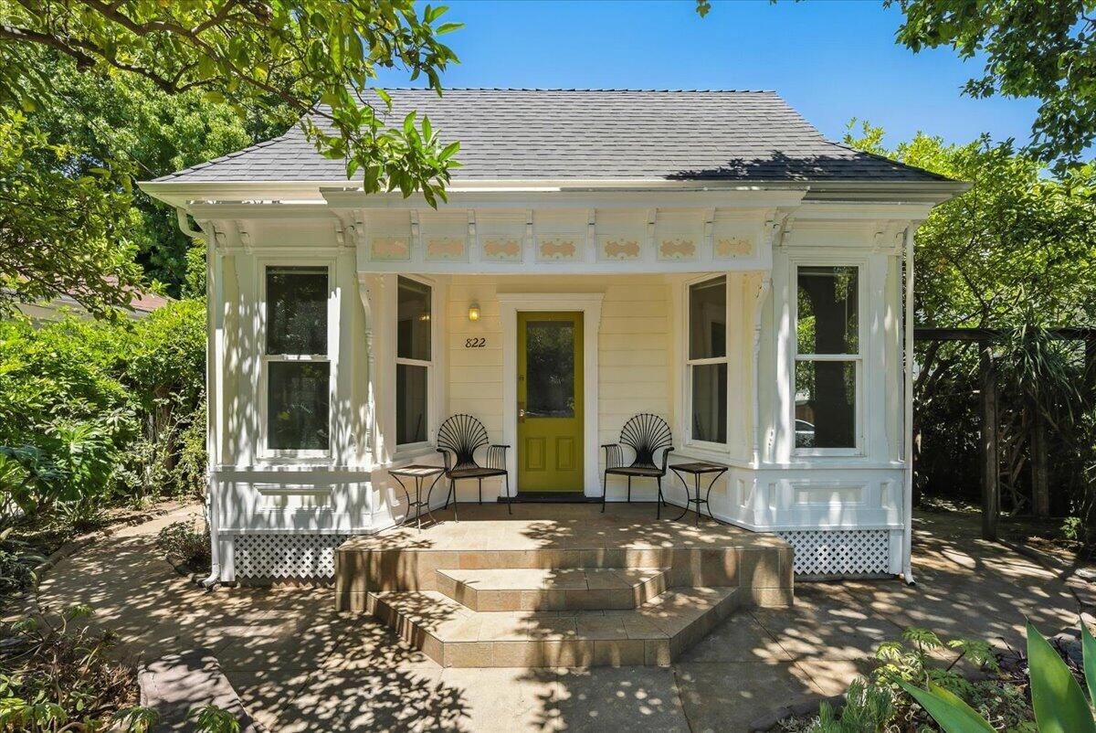 a front view of a house with sitting area