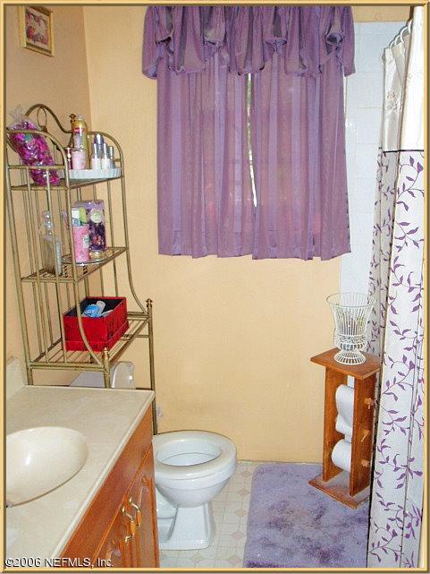 6415 Gaskins Road Jacksonville, FL 32244 - Photo 6 of 10 a bathroom with a toilet and a sink