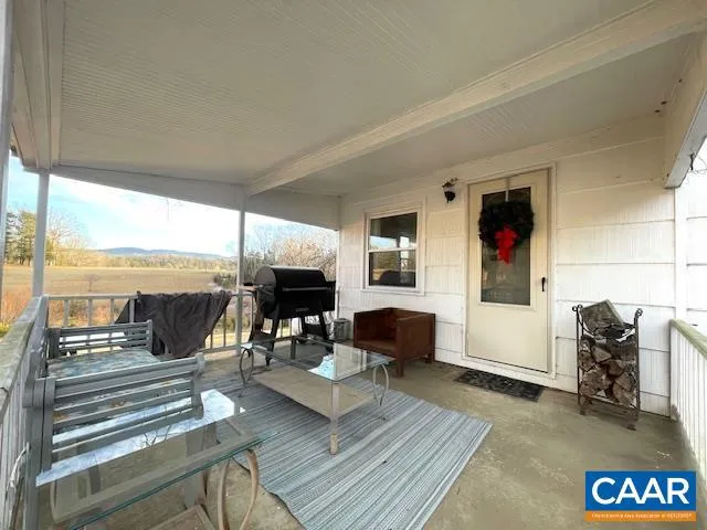 a living room with furniture fireplace and a table
