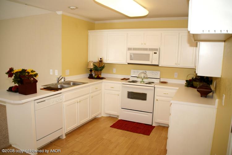 3617 South Mirror Street Amarillo, TX 79118 - Photo 4 of 15 a kitchen with a sink cabinets and a window