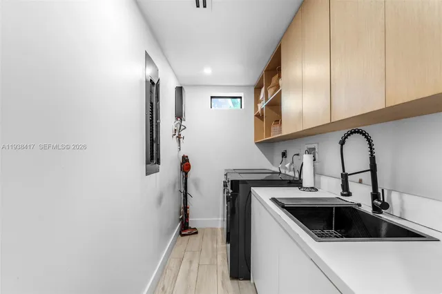 a bathroom with a sink and mirror