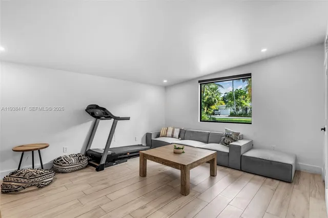 a view of a dining room with furniture and a window
