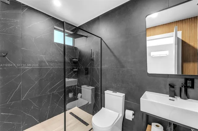 a bedroom with bed and a night stand