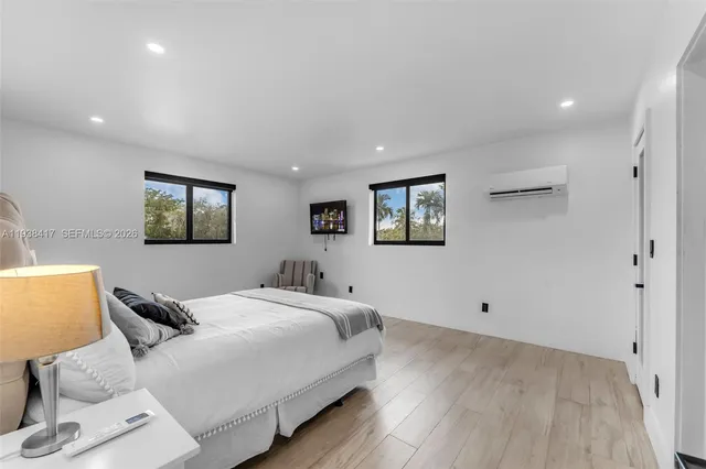 a view of house with swimming pool outdoor seating