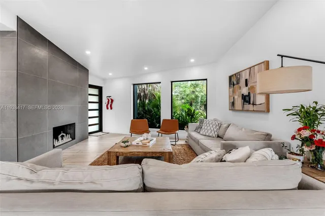 a large kitchen with a table and chairs