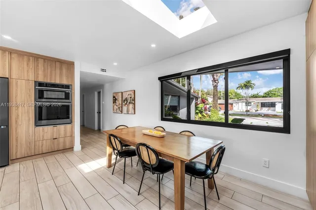 a spacious bathroom with a toilet a sink and bathtub