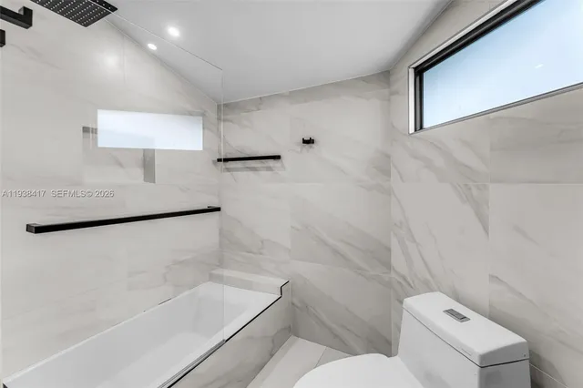 a view of a workspace with furniture and a gate