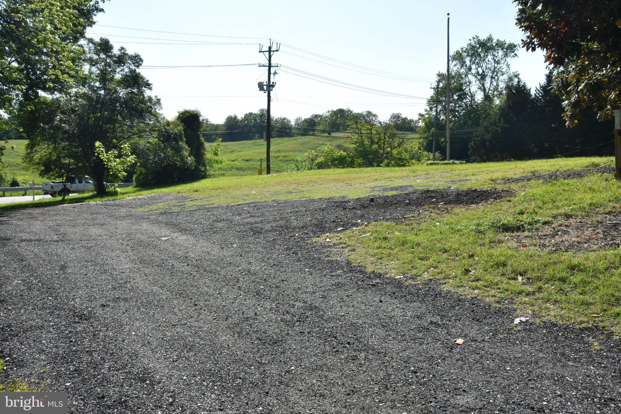 8610 Croom Road Upper Marlboro, MD 20772 - Photo 6 of 14 a view of a field with a tree