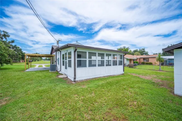 a view of a house with a big yard