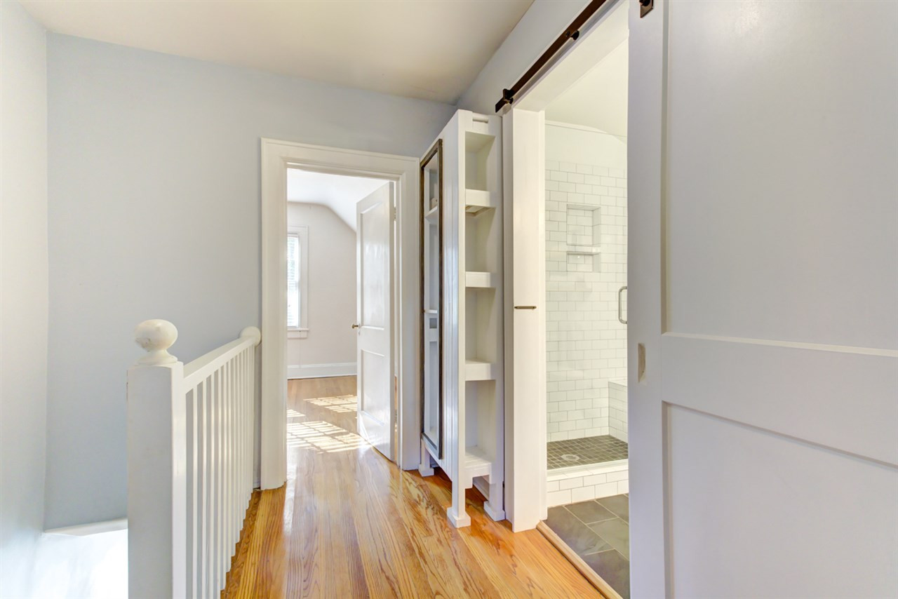 413 Dixie Trail Raleigh, NC 27607 - Photo 18 of 30 Second floor hall shows off beautiful hardwoods and open feel to bungalow 2nd Floor Hallway
