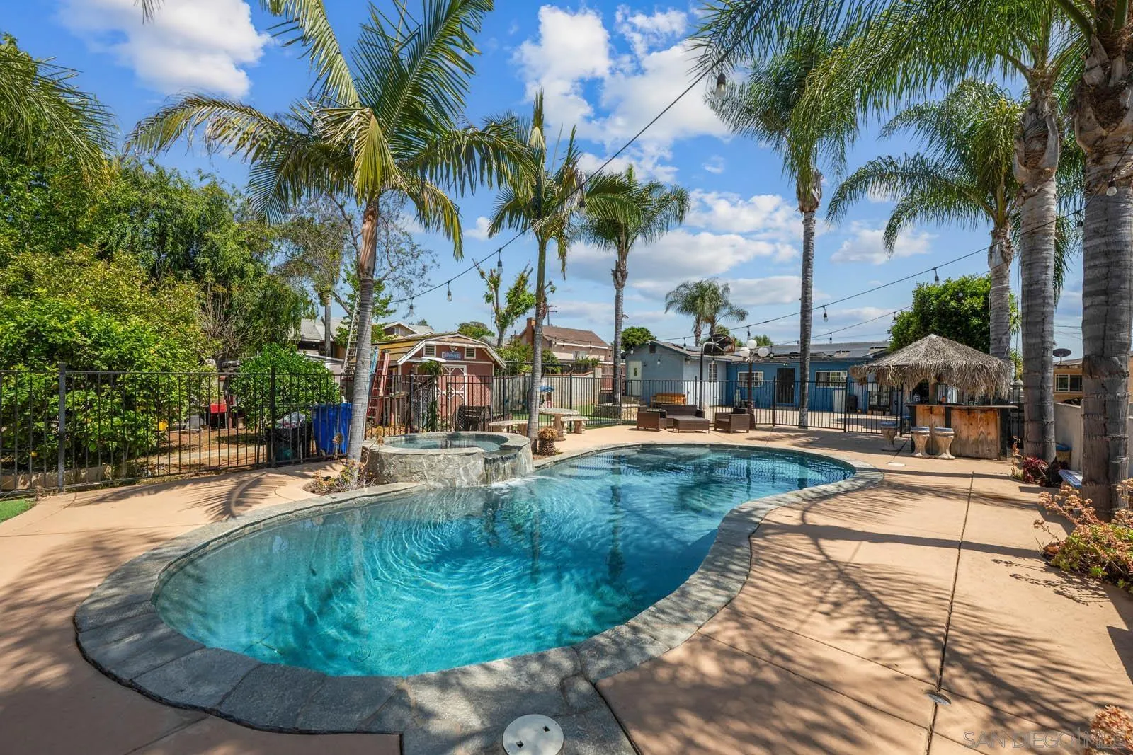 a view of a swimming pool with a sitting area