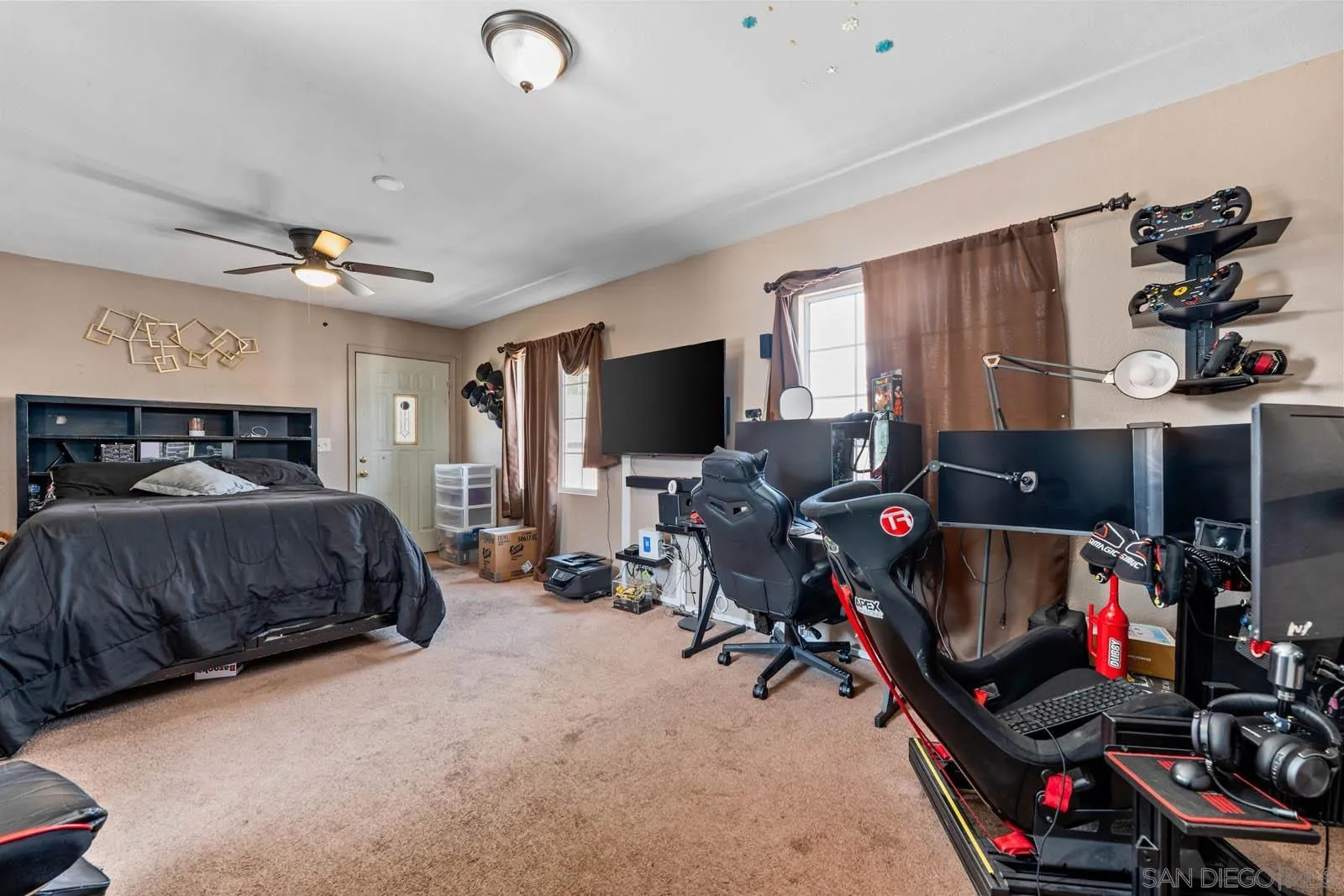 124 East View Street Fallbrook, CA 92028 - Photo 13 of 50 a bedroom with furniture a flat screen tv and a window