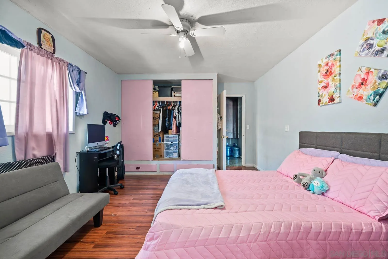 124 East View Street Fallbrook, CA 92028 - Photo 14 of 50 a bedroom with a bed and a couch