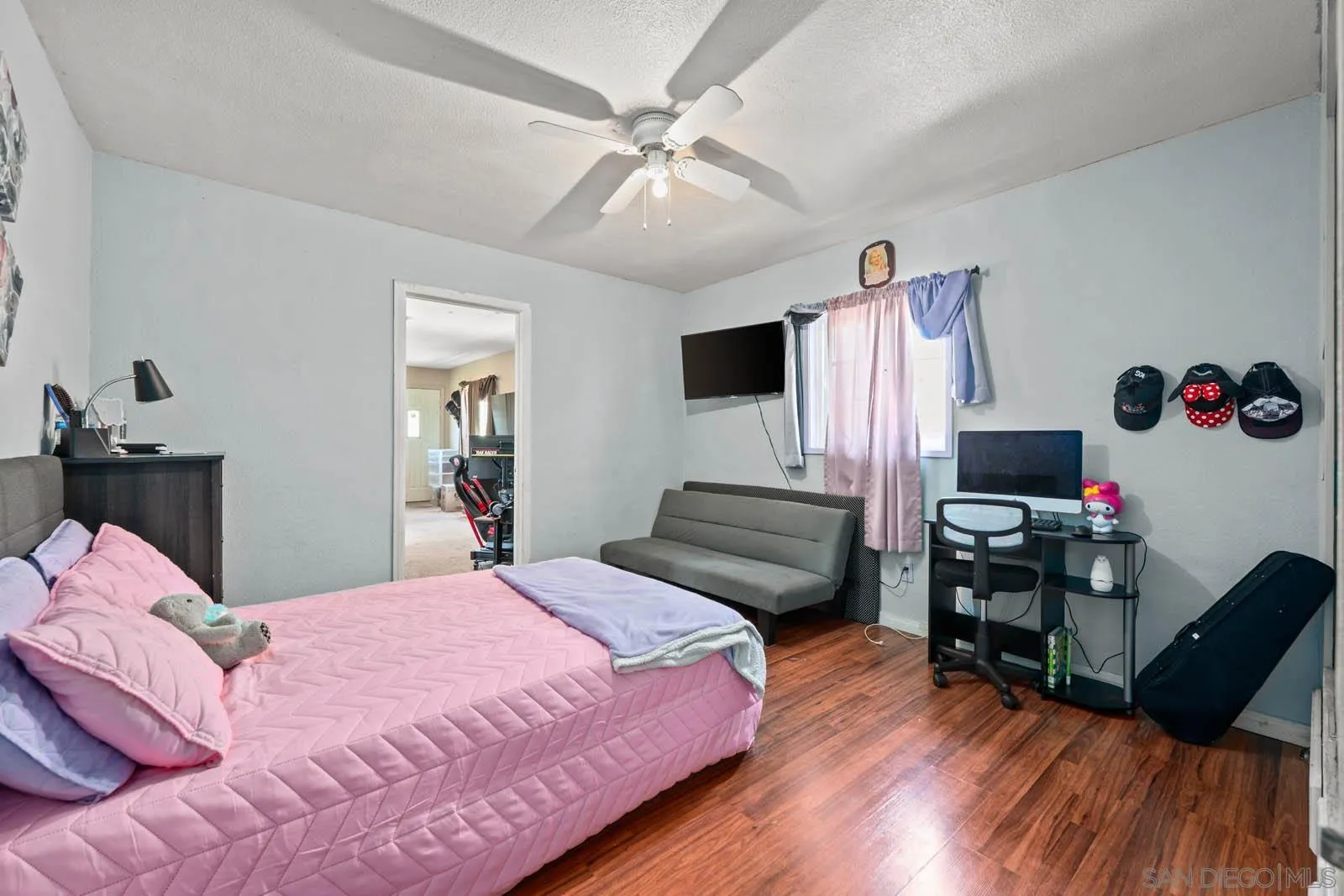 124 East View Street Fallbrook, CA 92028 - Photo 15 of 50 a bedroom with a bed and wooden floor