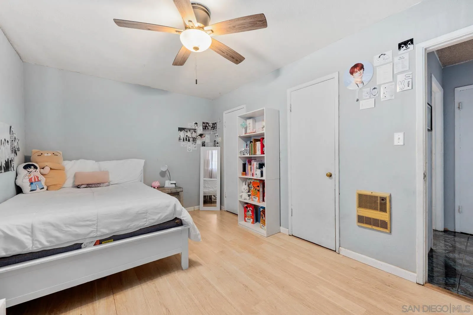 124 East View Street Fallbrook, CA 92028 - Photo 22 of 50 a bedroom with a bed chandelier and a window