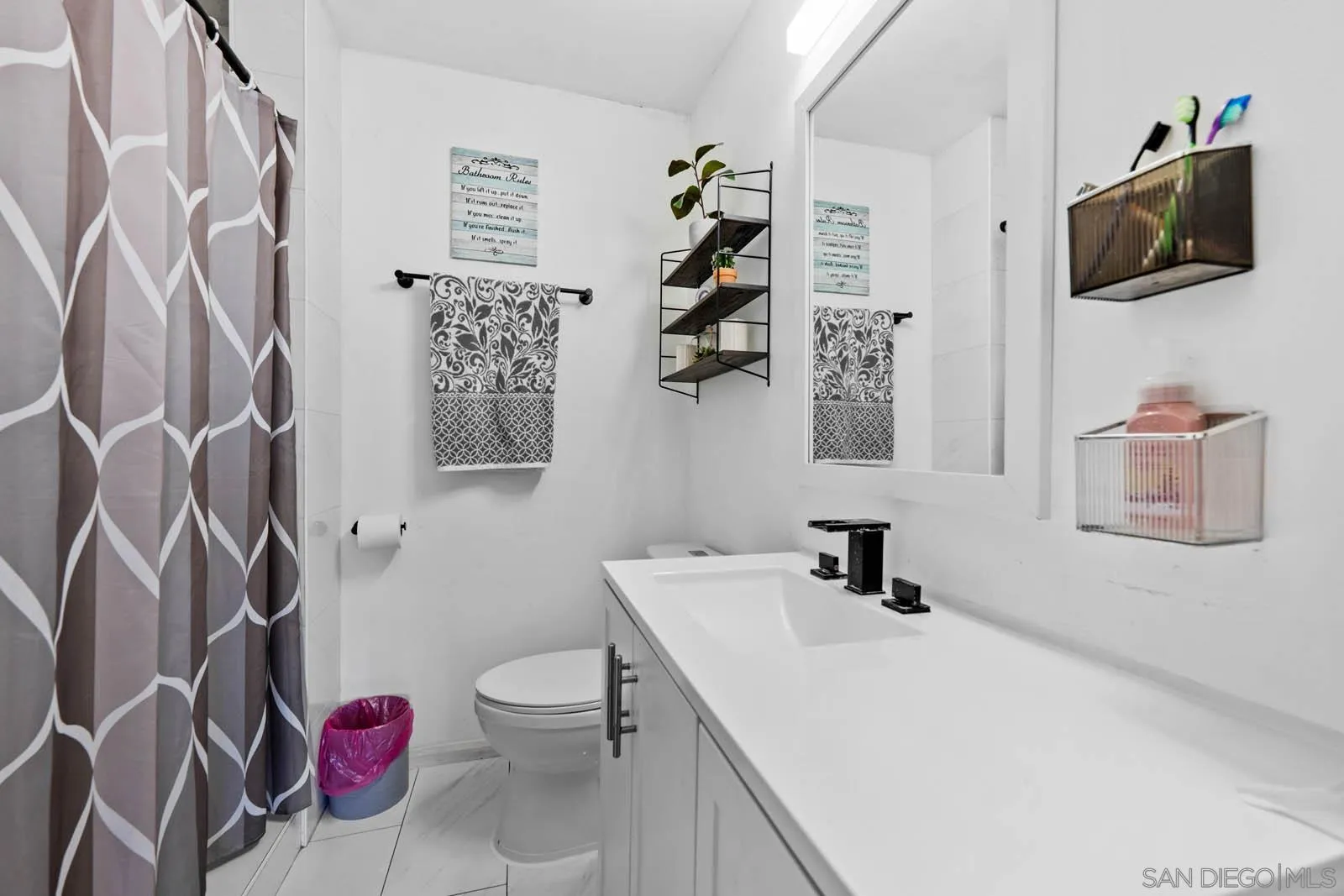 124 East View Street Fallbrook, CA 92028 - Photo 26 of 50 a bathroom with a sink vanity mirror and toilet