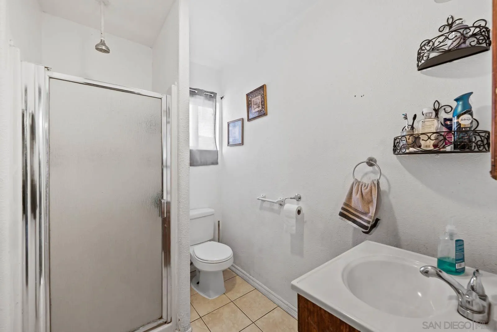 124 East View Street Fallbrook, CA 92028 - Photo 27 of 50 a bathroom with a sink toilet and shower